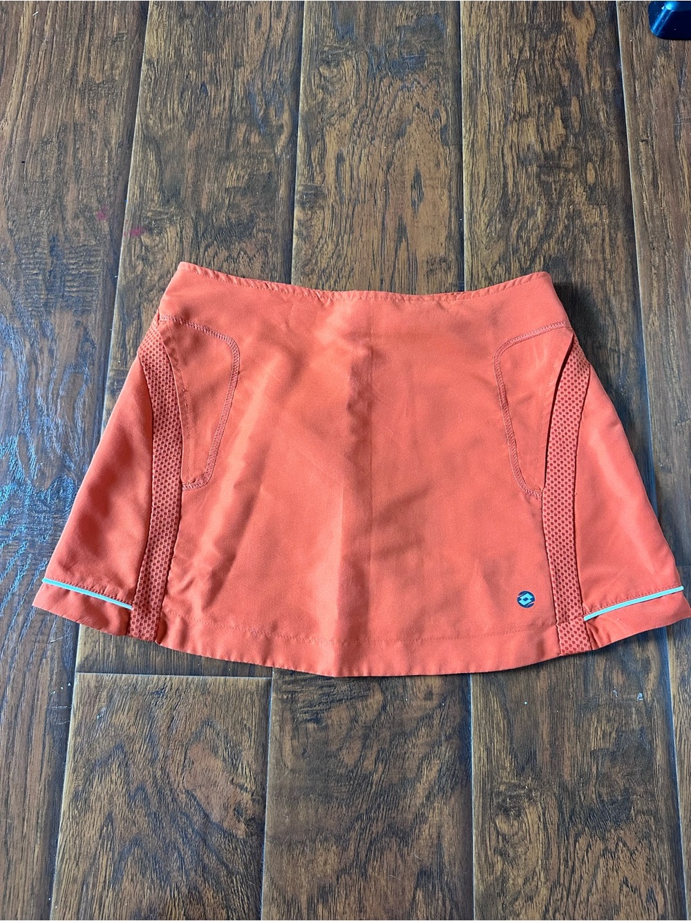 Women’s Active Mini Skirt in Coral Orange with Mesh Panels